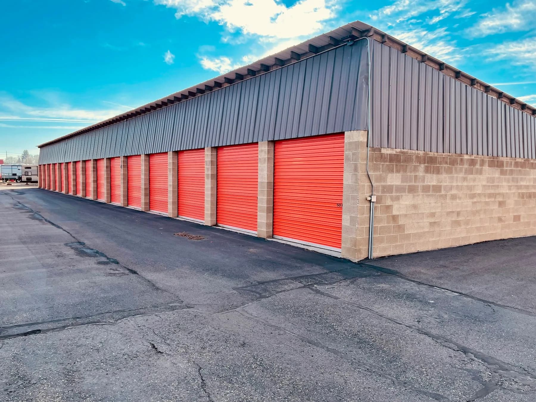 Completed commercial metal building with garage bay doors