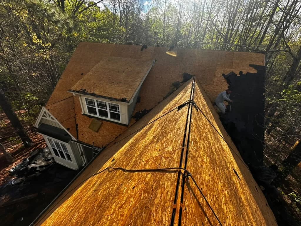 Roof deck stripped down to sheathing before new shingles